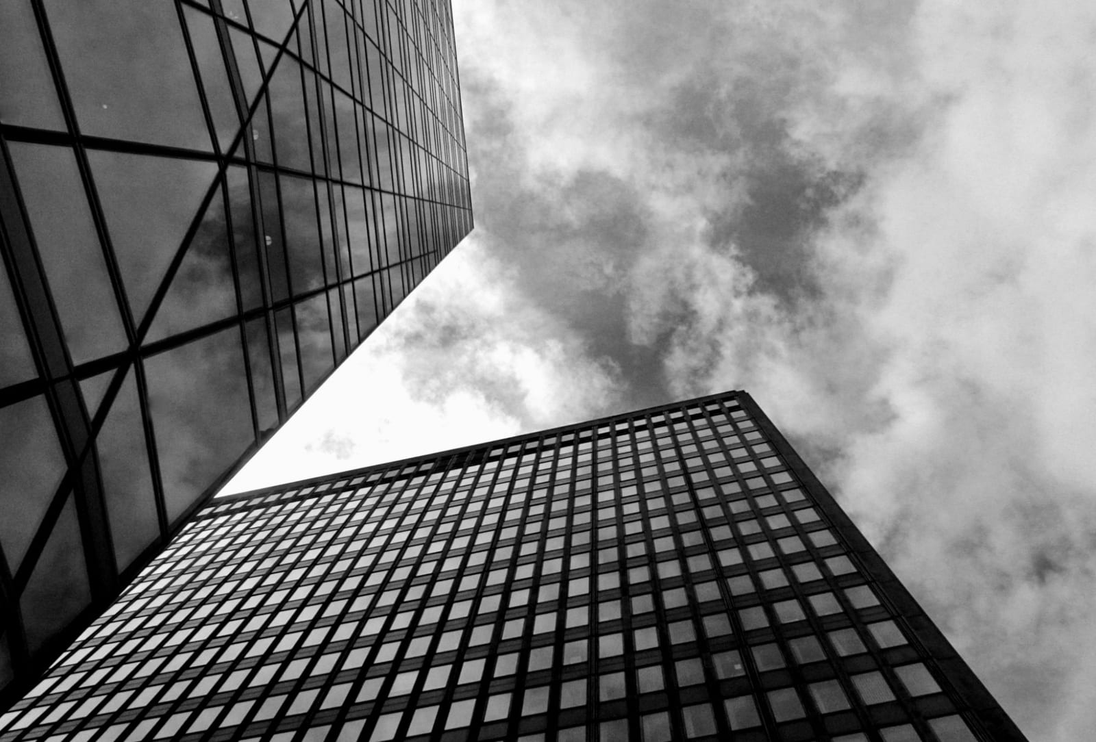 Two office towers seen from street level